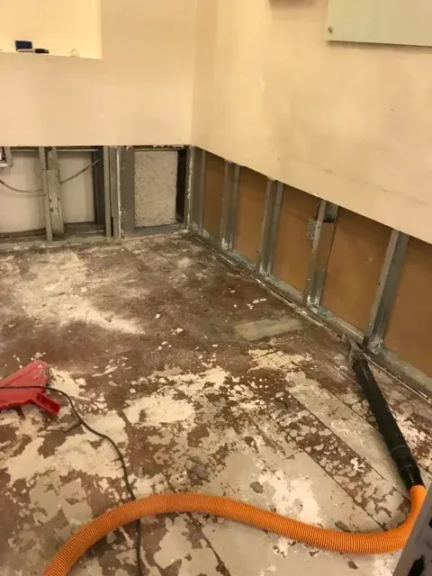 A frozen and split water pipe in an exterior wall of an Arlington, VA home